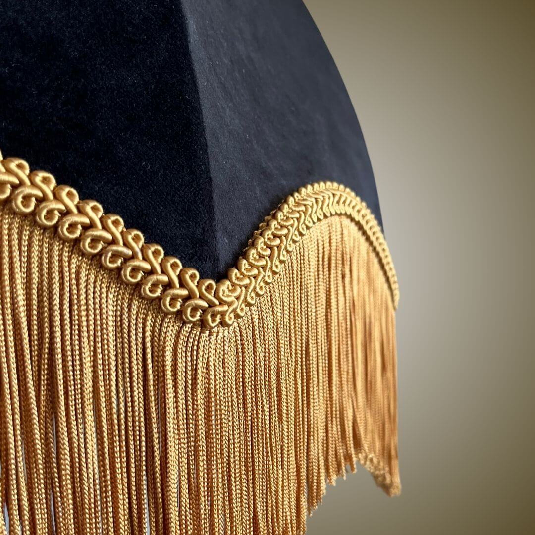Close up of fringe detail on black velvet dome lampshade