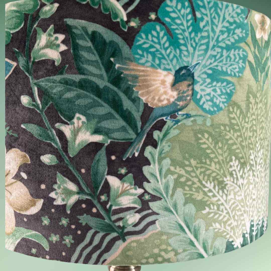close up of Drum lampshade with bold green floral pattern in a william morris style