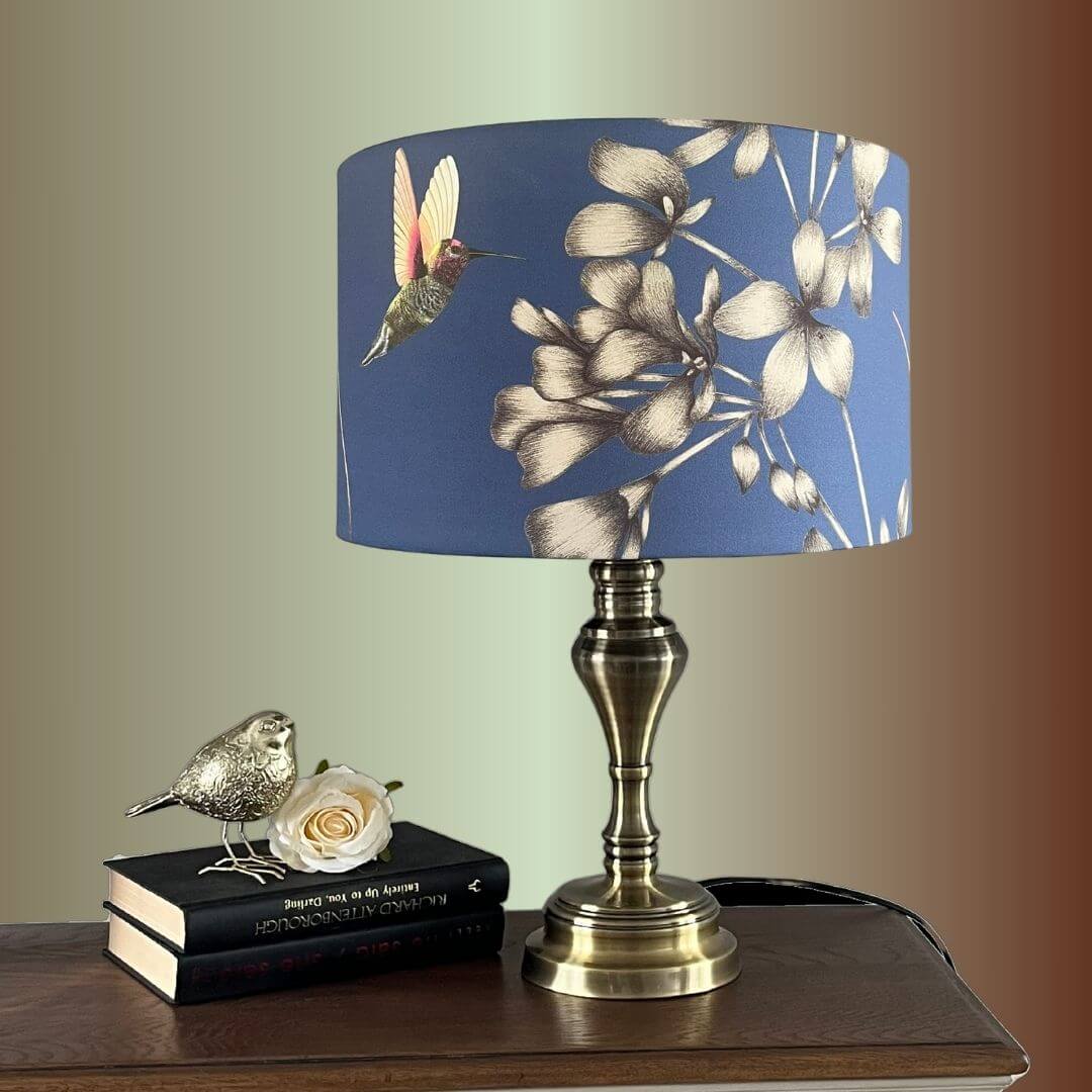 Indigo Blue Lampshade with Florals & Hummingbirds fabric by Harlequin Amazillia on Brass lampstand