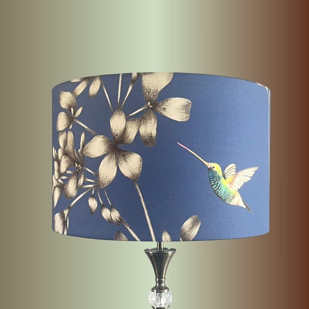 Indigo Blue Lampshade with Florals & Hummingbirds fabric by Harlequin Amazillia on lampstand