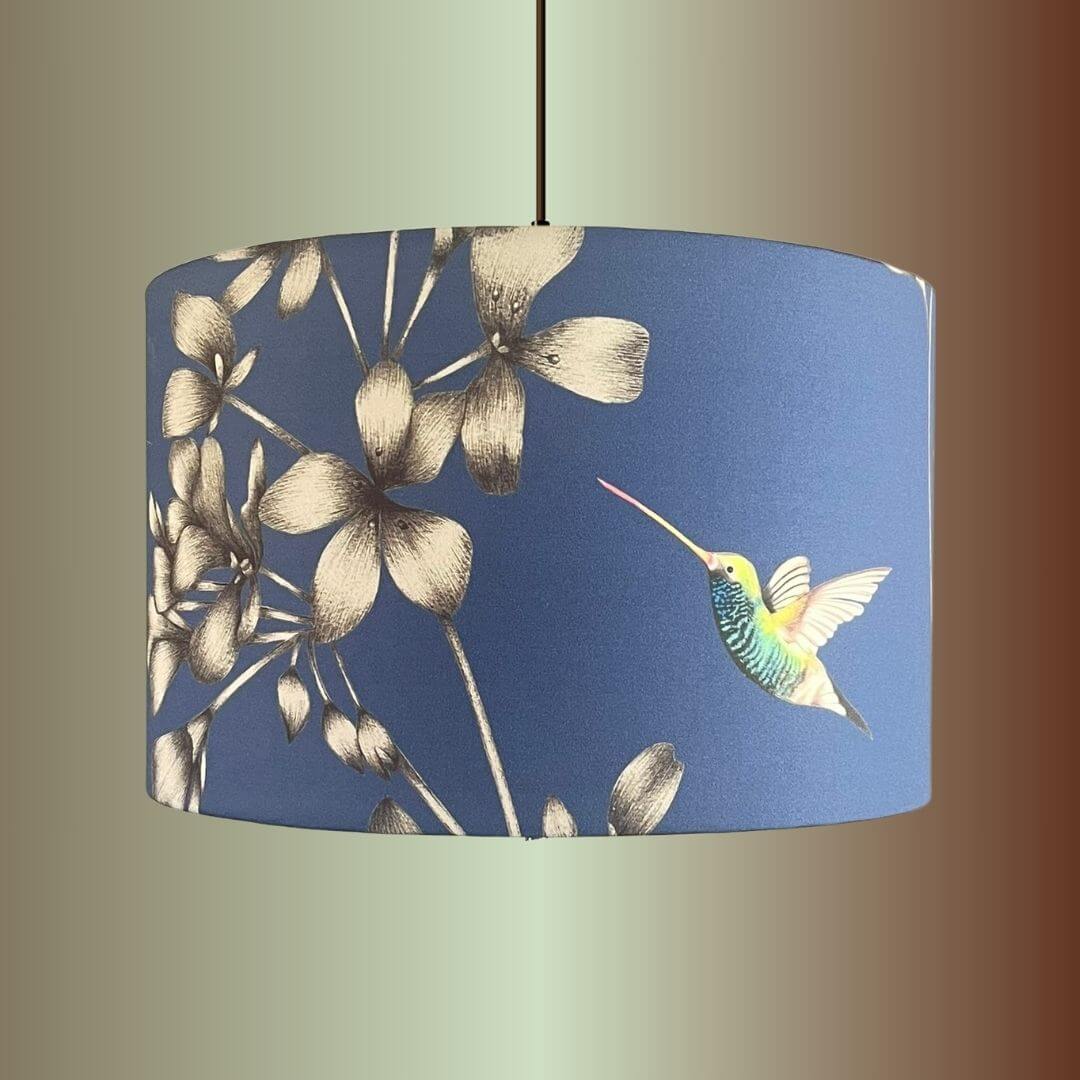 Indigo Blue Lampshade with Florals & Hummingbirds fabric by Harlequin Amazillia on a pendant