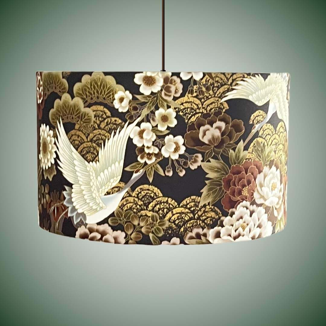 Japanese cranes and florals drum lampshade with metallic accents shown hung as pendant