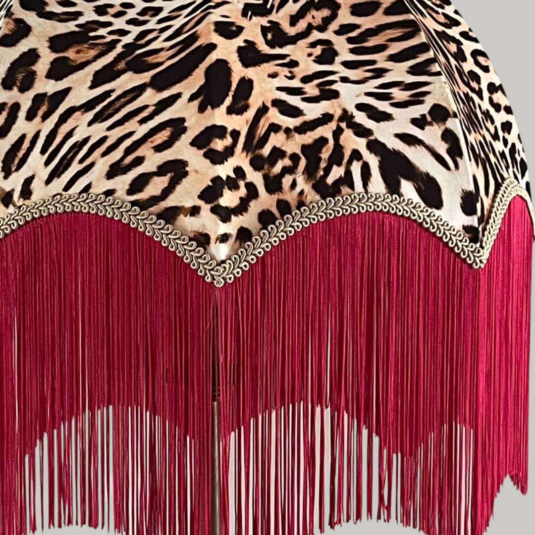 Leopard print dome lampshade with a hot pink fringe close up