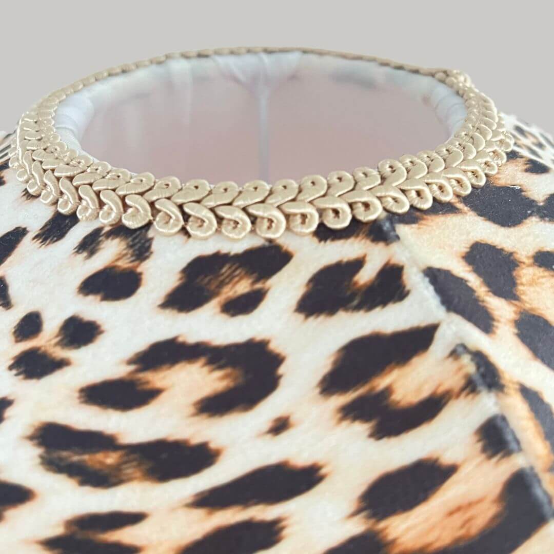 Leopard print dome lampshade with a hot pink fringe top view