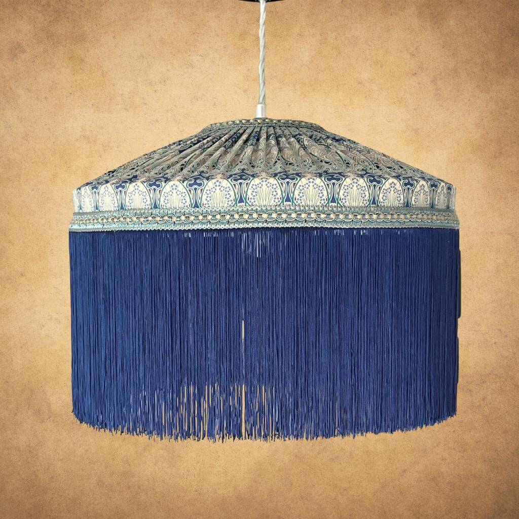 Tiffany style lampshade with Liberty art nouveau fabric and navy fringe on a pendant