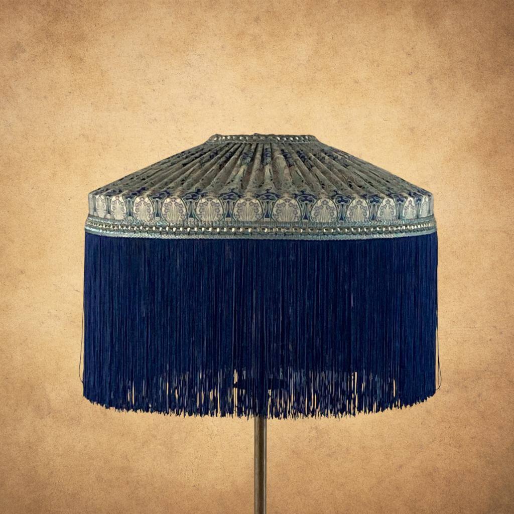 Tiffany pleated lampshade with Liberty Ianthe art deco fabric and deep navy fringe tassels and braid with metalic gold