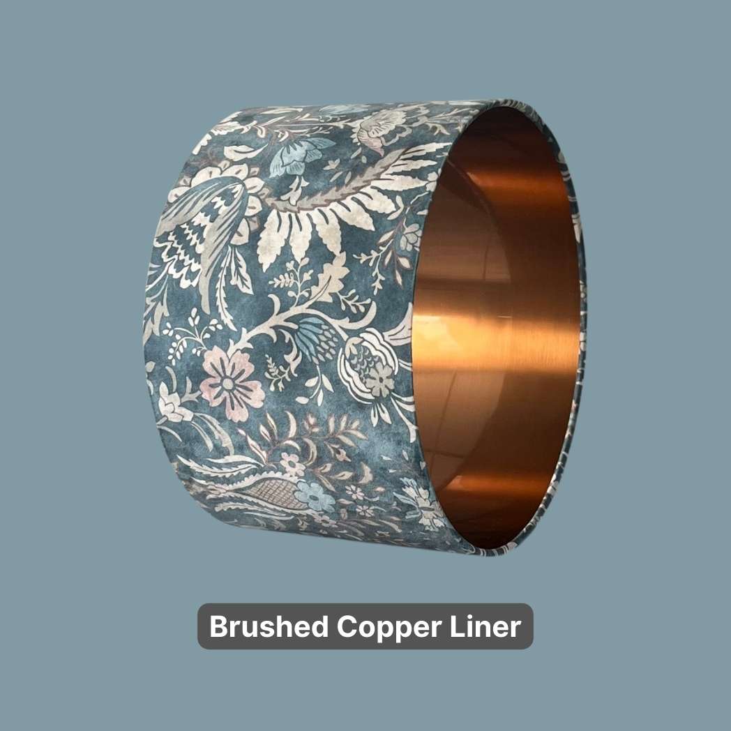 Art Nouveau style Blue Velvet Drum Lampshade shown with a bronze liner