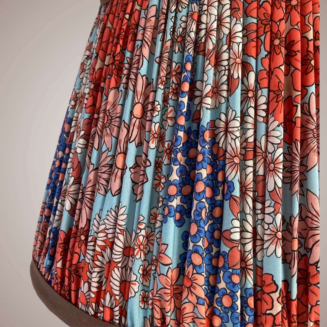Pleated lampshade in liberty style fabric small florals in orange, blue & turquoise with chocolate brown trim