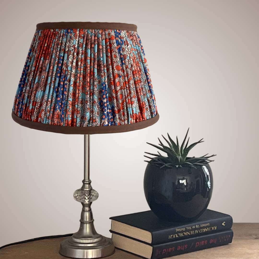 Pleated lampshade in liberty style fabric small florals in orange, blue & turquoise with chocolate brown trim top and bottom details