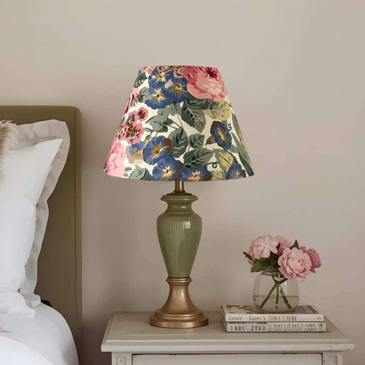 Rose and Peony empire conical floral lampshade shown on a lgreen lampbase on a bedside table