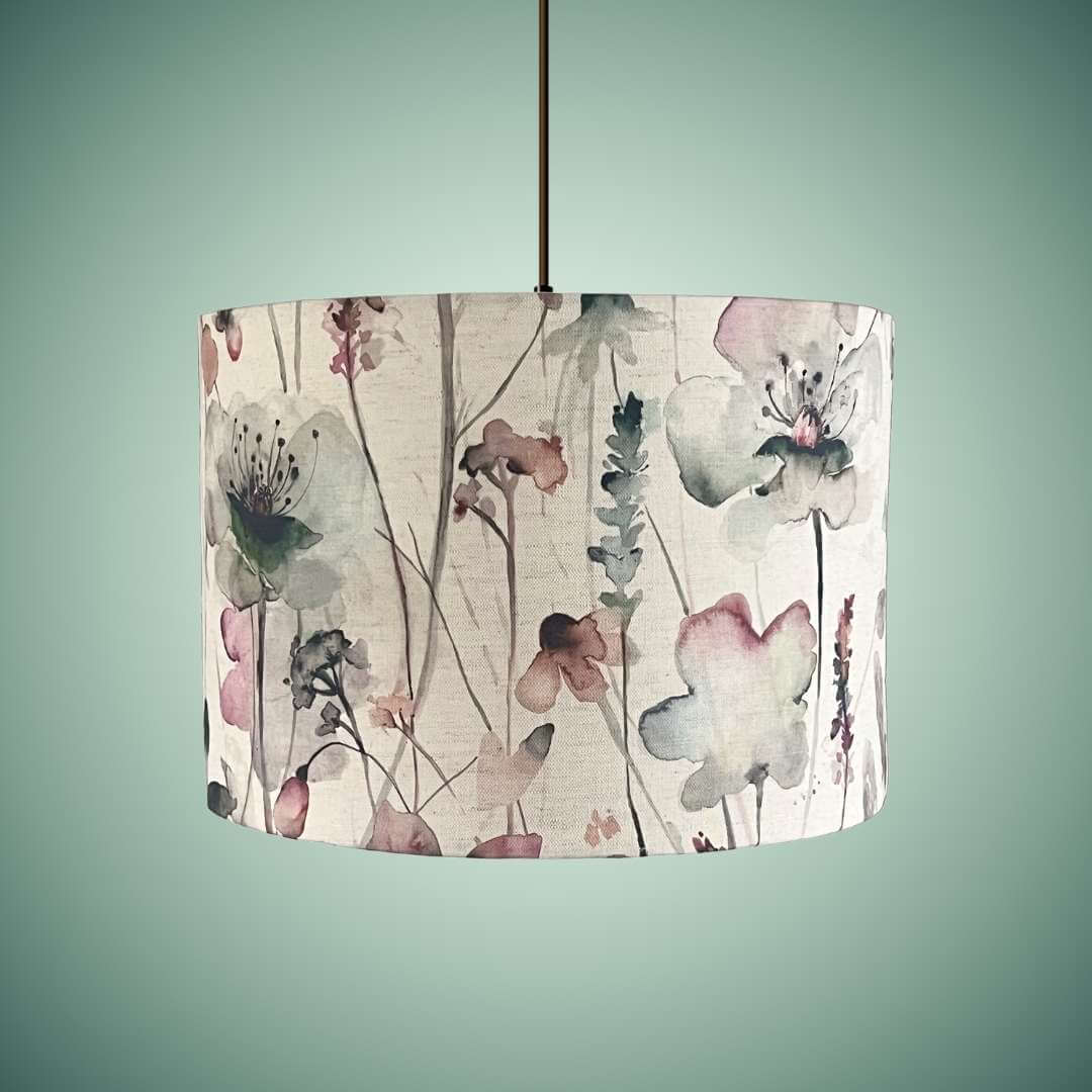 Drum lampshade in a watercolour style floral fabric by voyage maison on a celing pendant