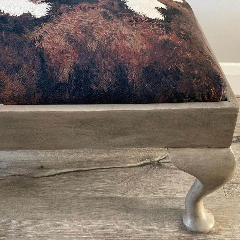 vintage footstool restored and reupholstered in luxury cowprint velvet