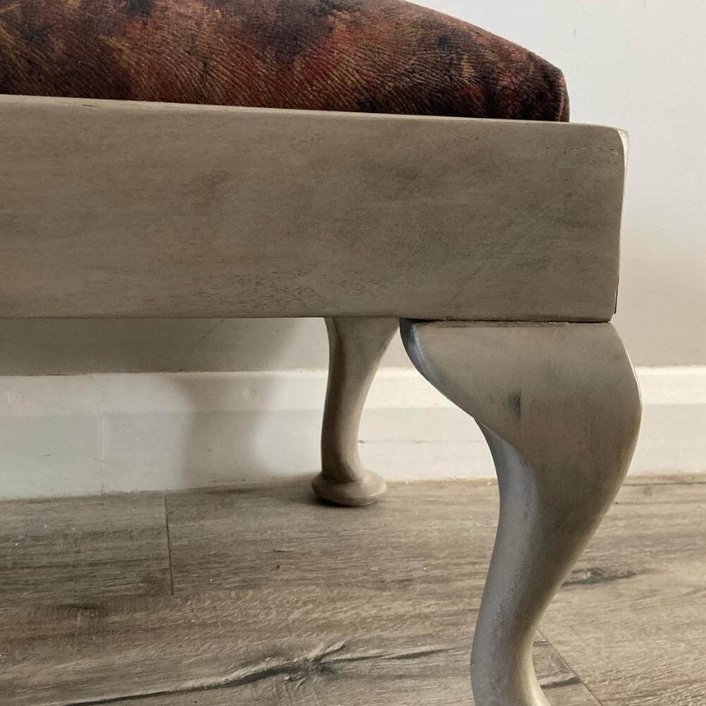 vintage footstool restored and reupholstered in luxury cowprint velvet