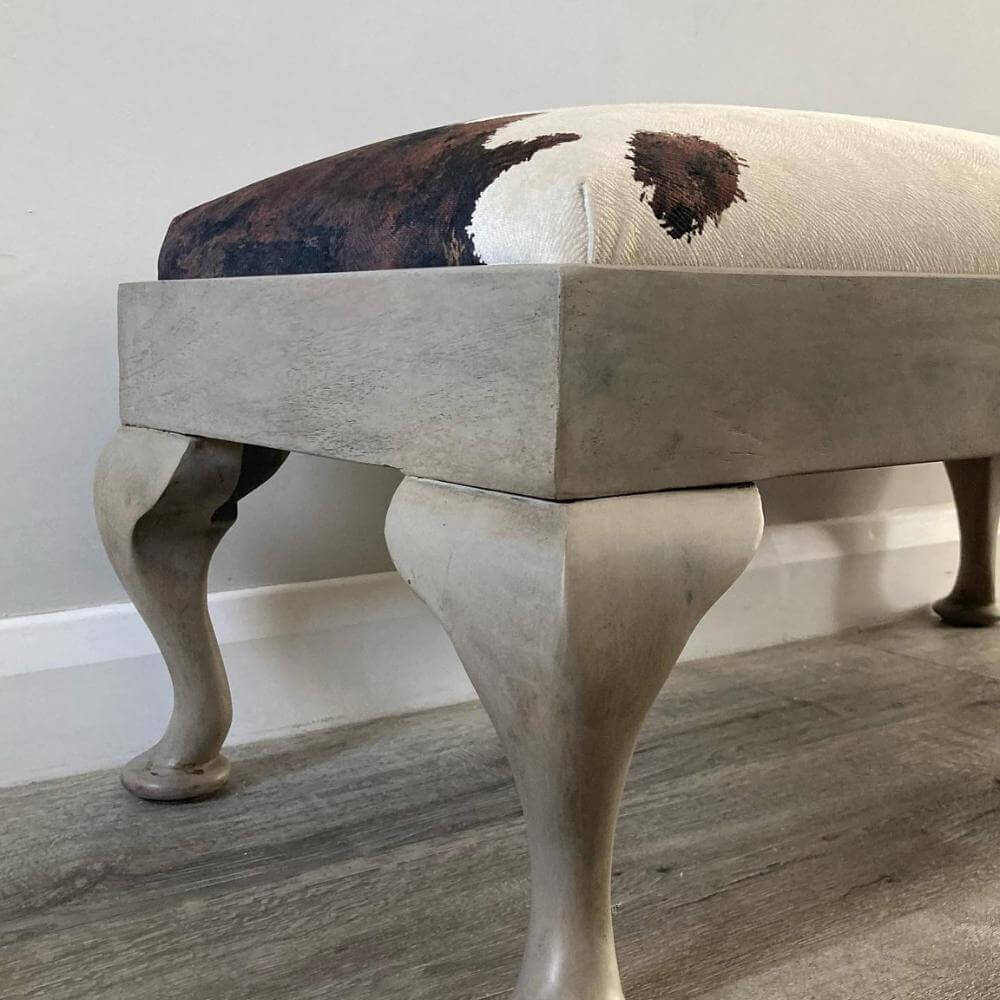 vintage footstool restored and reupholstered in luxury cowprint velvet