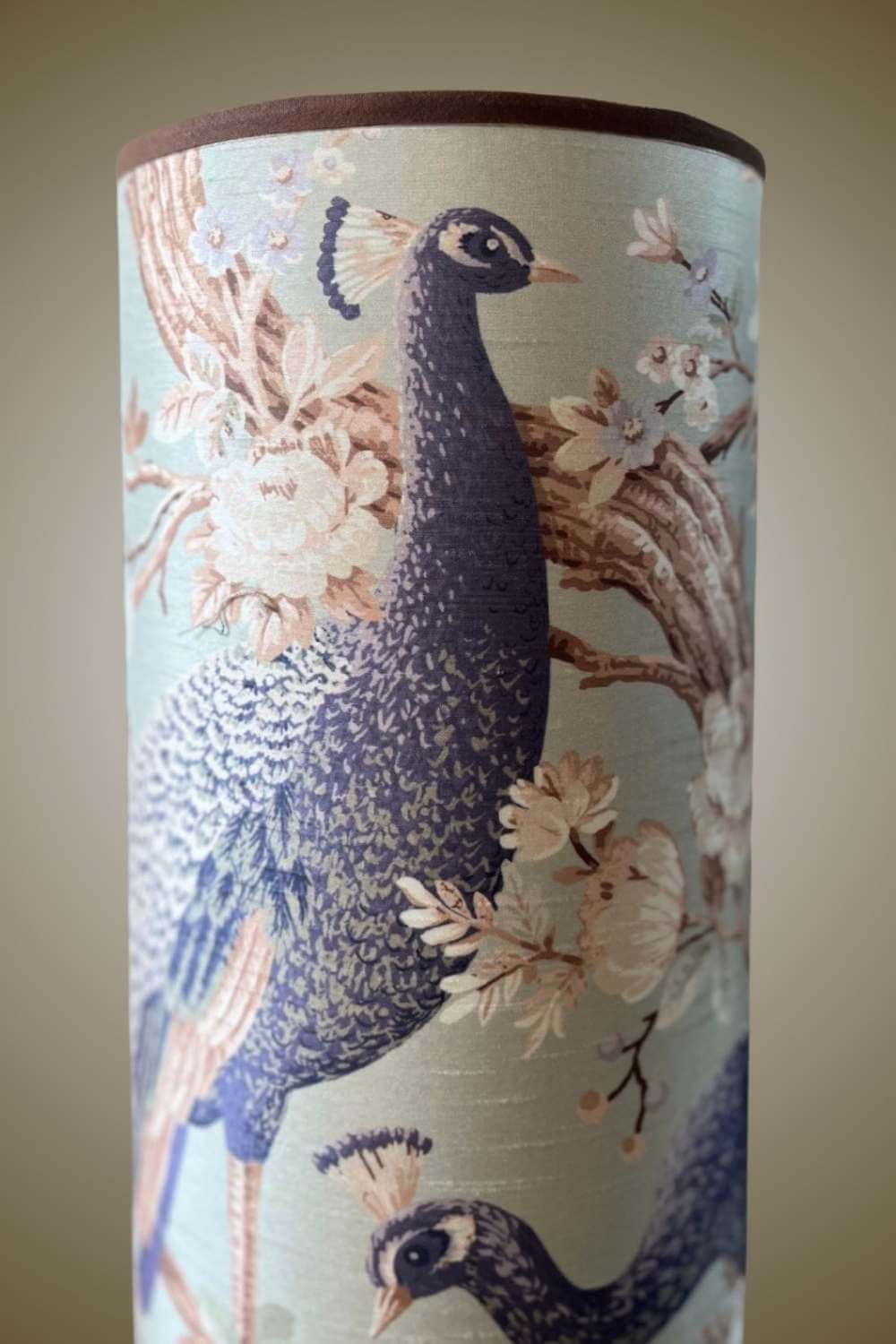 Tall floor lamp with large scale peacock design
