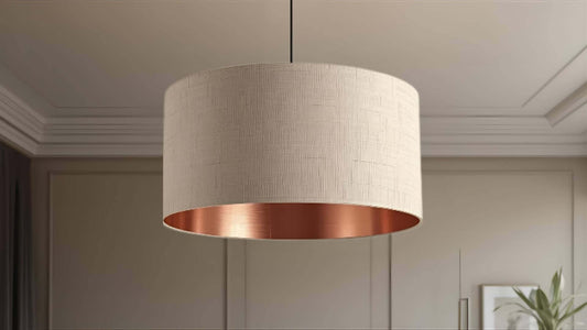 Linen lampshade with a copper lining shown hanging on a ceiling pendant