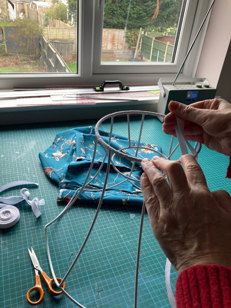 hand binding a lampshade frame