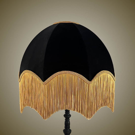 Black velvet dome vintage style lampshade with deep gold fringe on a black lamp base