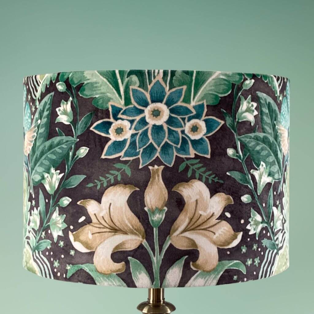 Drum lampshade with bold green floral pattern in a william morris style