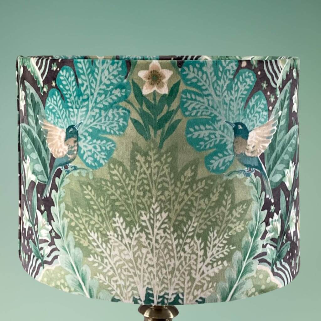 Drum lampshade with bold green floral pattern in a william morris style, rear view