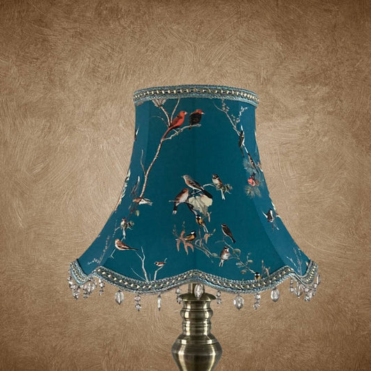 bowed empire vintage style lampshade with scalloped base, teal fabric and colourful garden birds, trimmed with a smoke grey beaded trim and braid with gold details