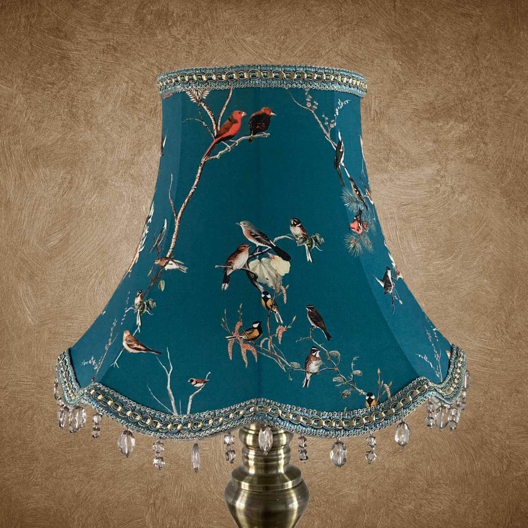 bowed empire vintage style lampshade with scalloped base, teal fabric and colourful garden birds, trimmed with a smoke grey beaded trim and braid with gold details