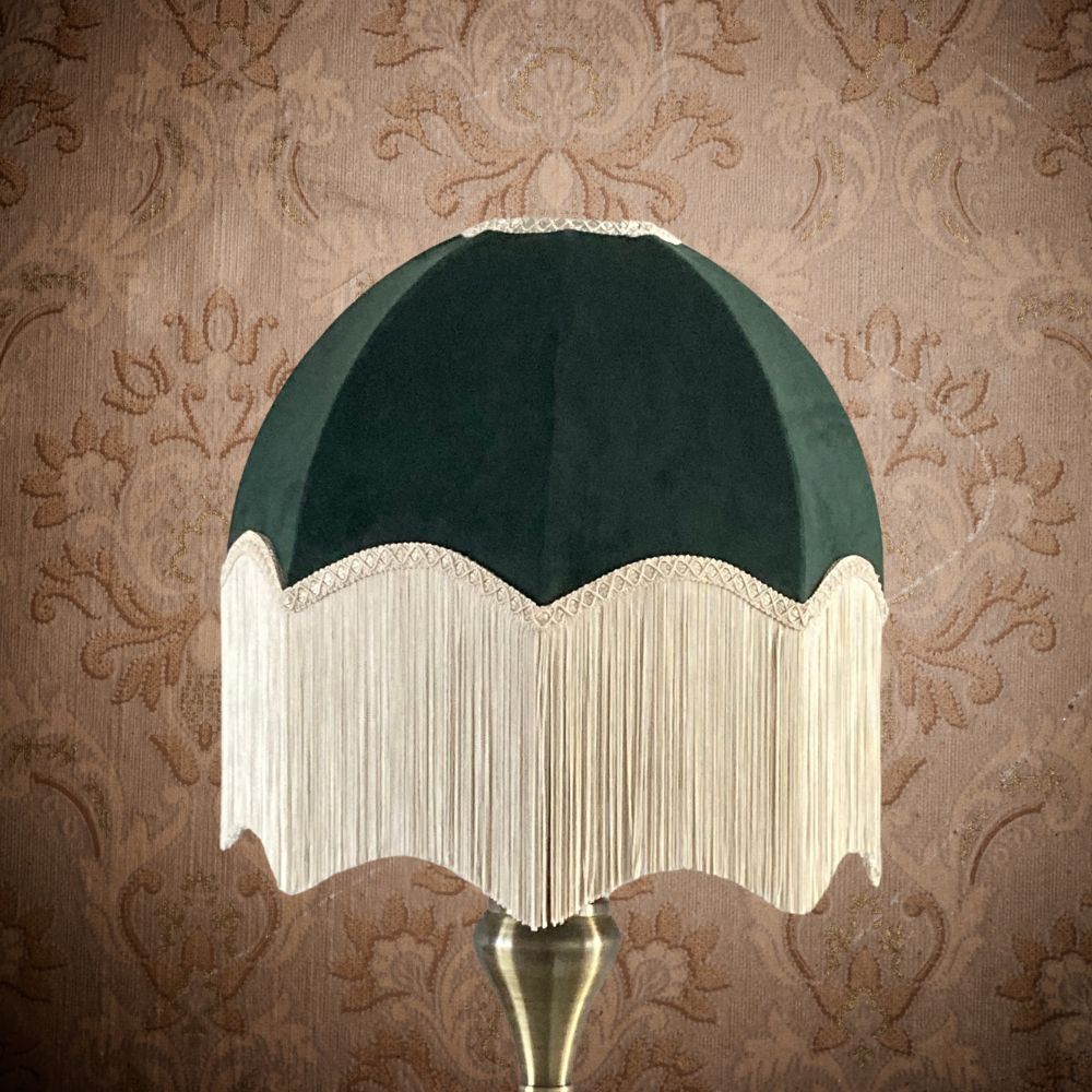 Dark green velvet vintage style dome or parachute lampshade with a deep ivory fringe on a brass lamp base