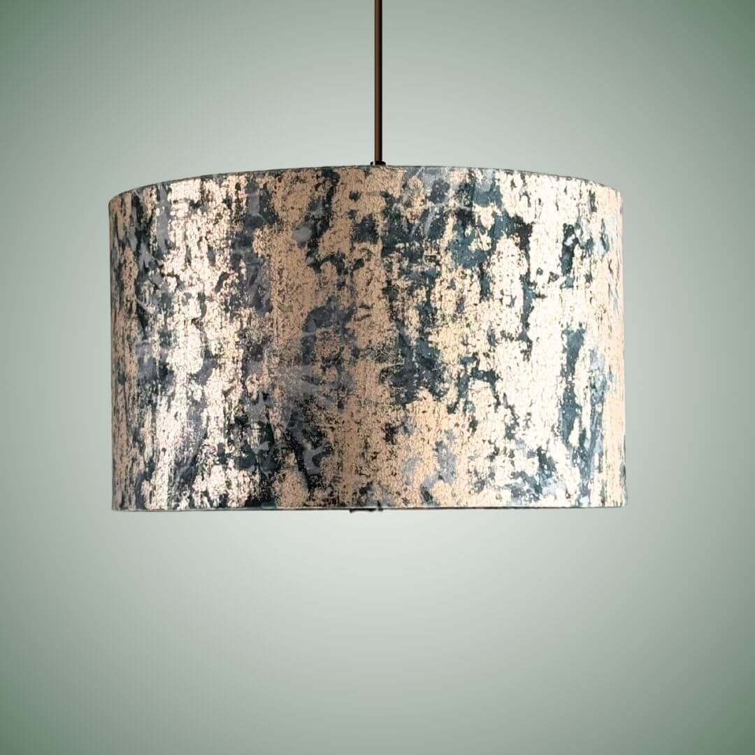 Clarke & Clarke Dipinto velvet lampshade in the teal colourway shown on a ceiling pendant.