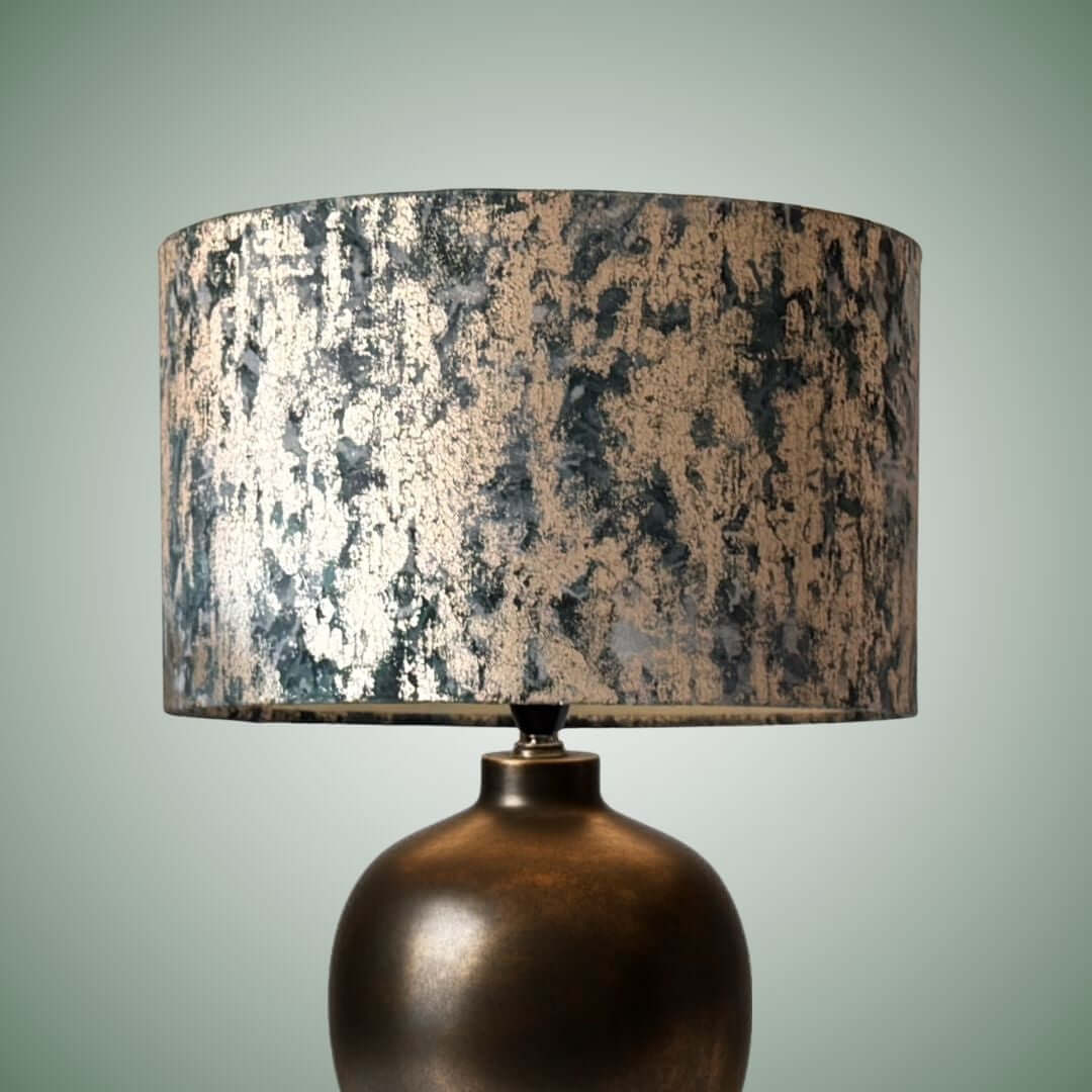 Clarke & Clarke Dipinto velvet lampshade in the teal colourway shown on a brass lampbase
