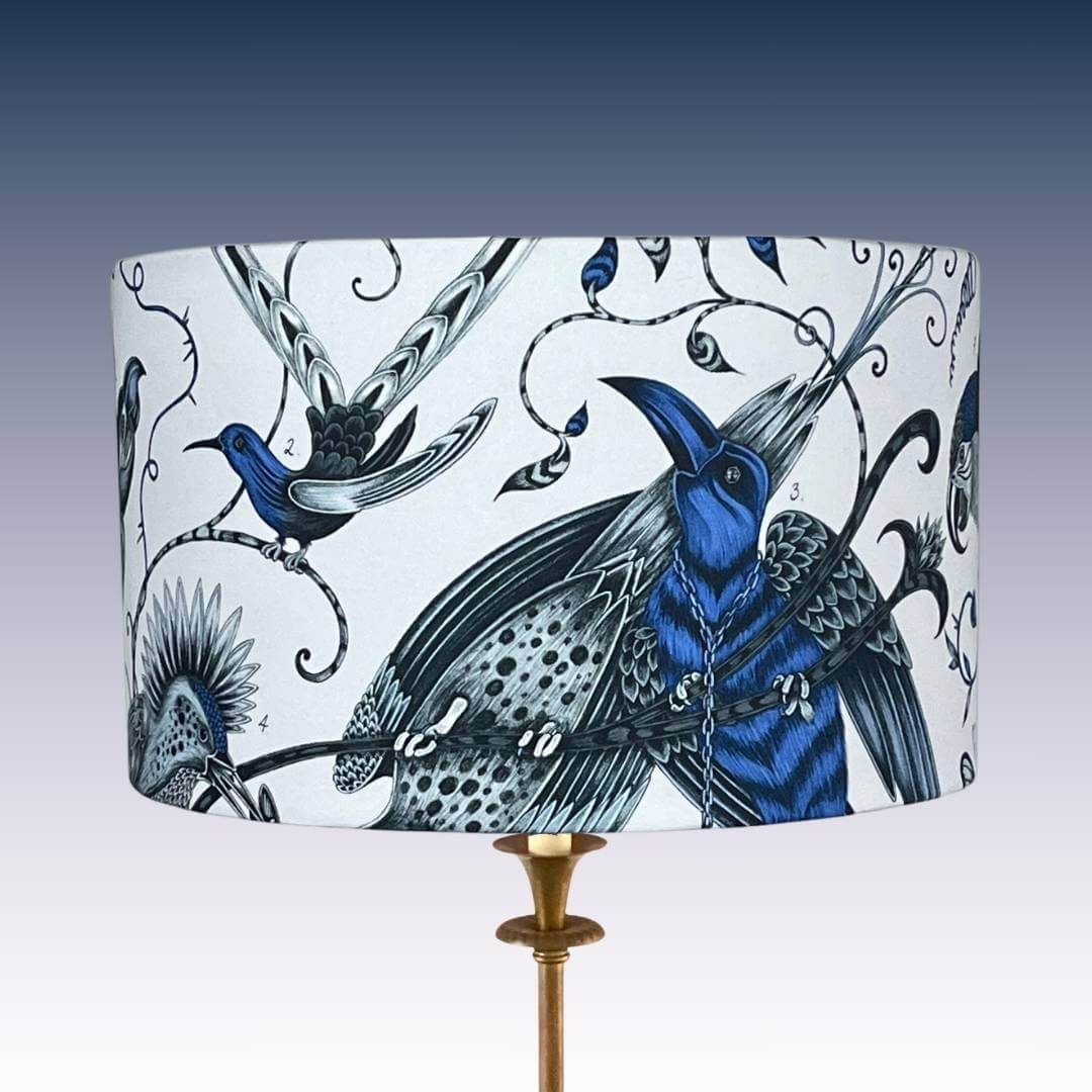 Emma J Shipley Audubon Drum Lampshade featuring exotic birds and foliage in shades of blue on a white background 