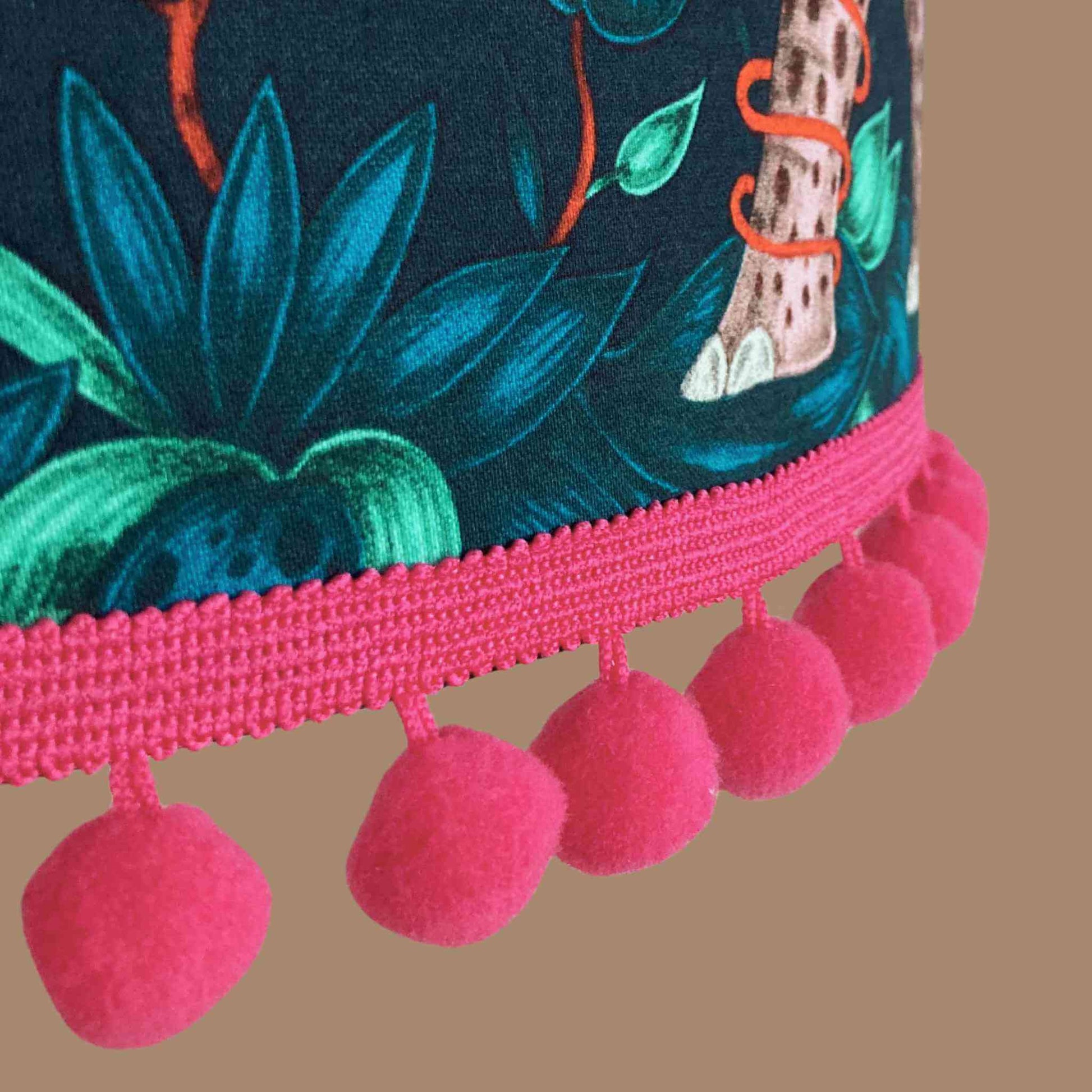 Emma J Shipley zambezi Drum Lampshade showing close up of fabric and hot pink pom pom trim