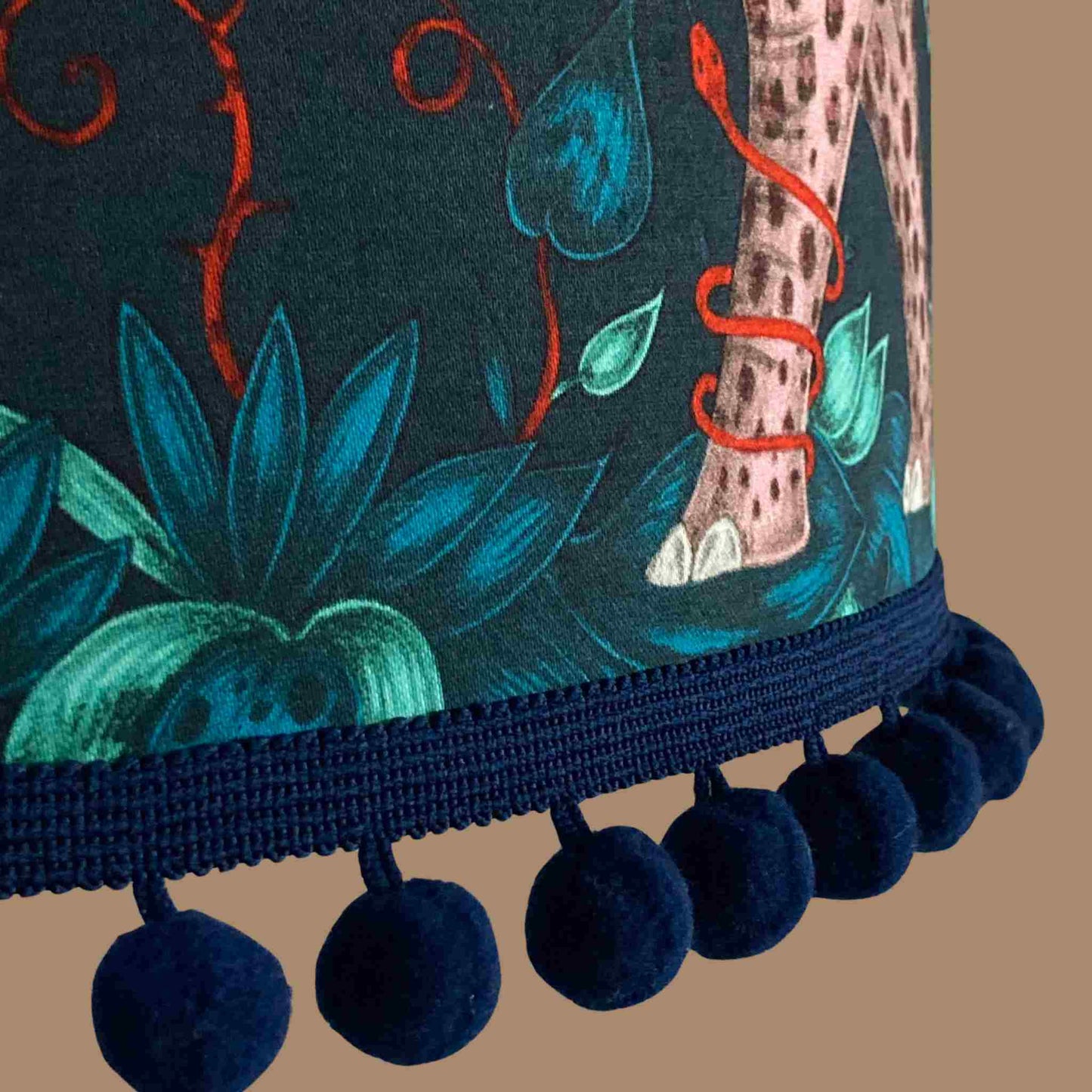 Emma J Shipley zambezi Drum Lampshade showing close up of fabric and blue pom pom trim