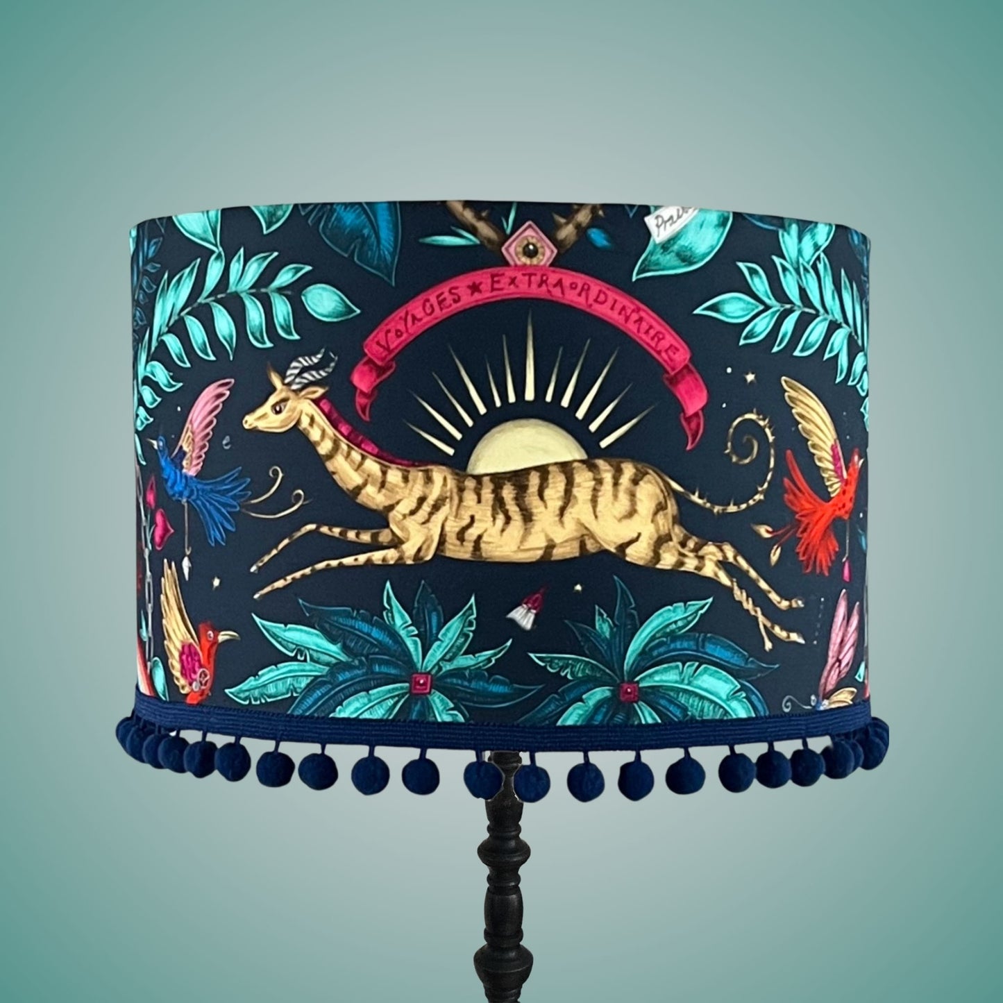 Emma J Shipley zambezi Drum Lampshade with pom pom fringe on standing lamp