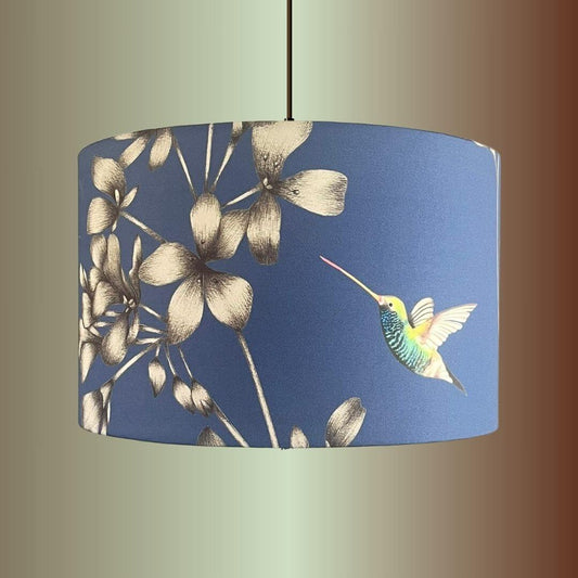Indigo Blue Lampshade with Florals & Hummingbirds fabric by Harlequin Amazillia on a pendant 