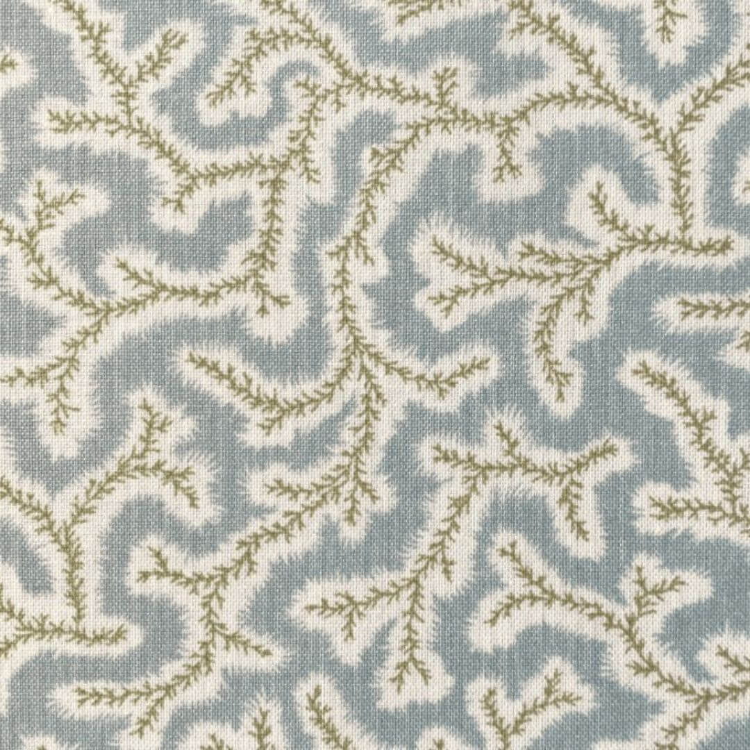 Close-up of Ian Sanderson Dulcie fabric in Thyme, pale blue and green.