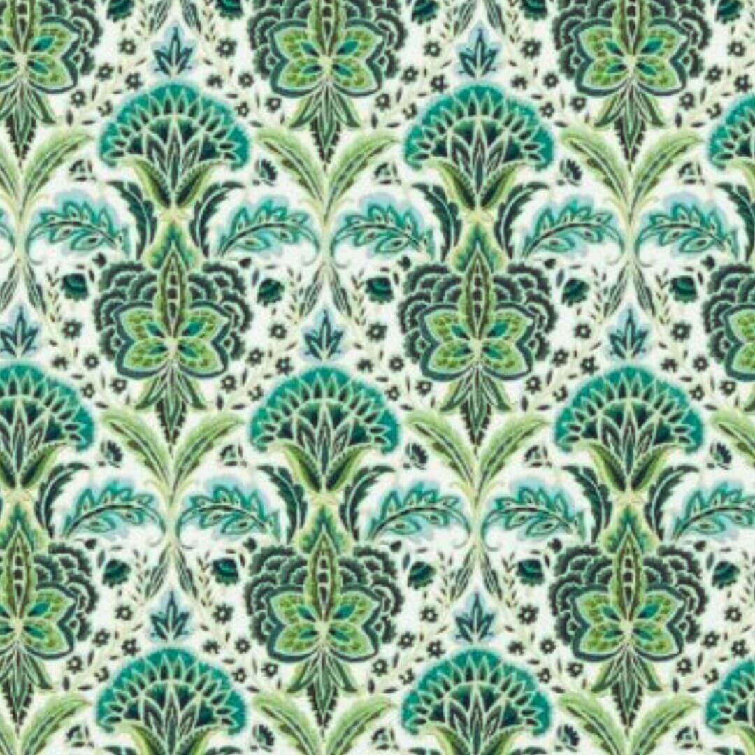 Rhapsody absinthe Patterned fabric with green and black design on a white background