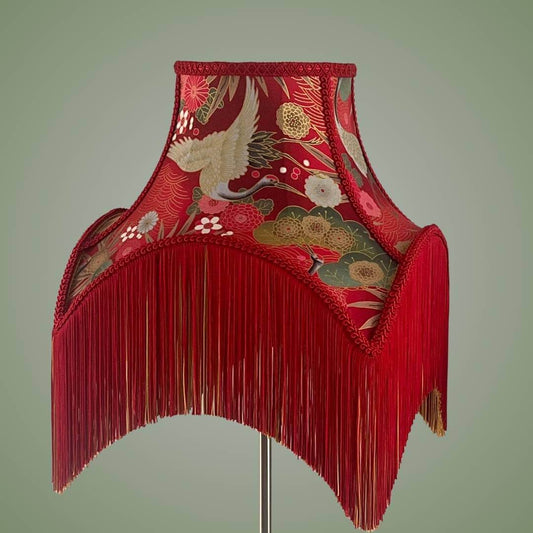 bowed empire lampshade with cut outs in red japanese fabric and fringe