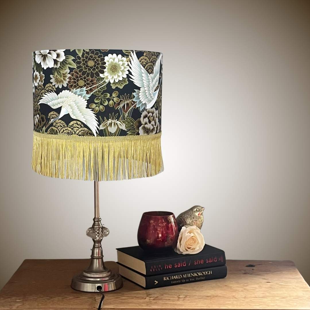 Japanese cranes and florals drum lampshade with gold fringe on lampstand 