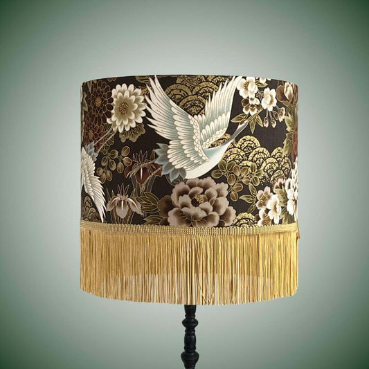 Japanese cranes and florals drum lampshade with gold fringe on black lamp base