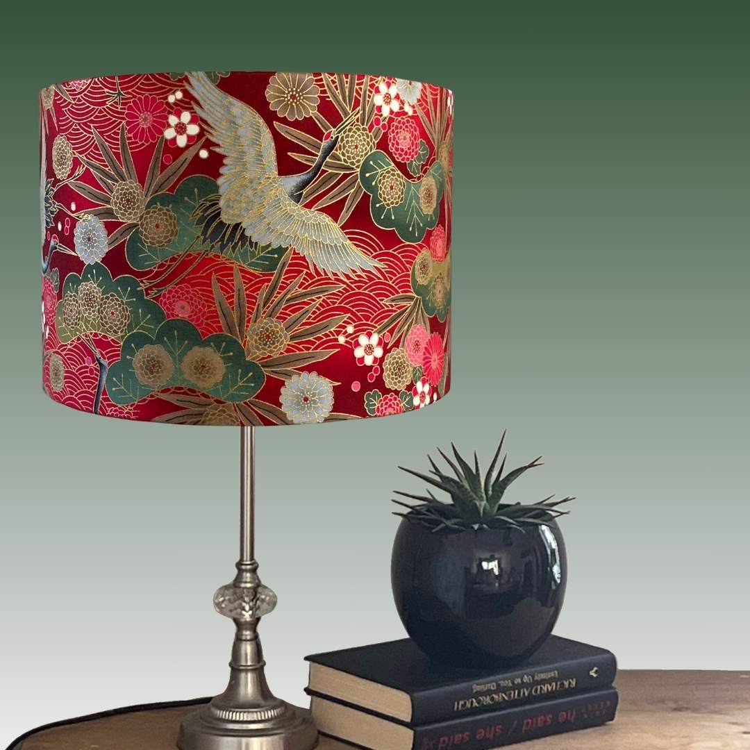 Drum Lampshade made with Authetic Japanese fabric with cranes, florals and metalic gold accents on console