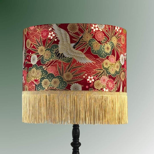 Drum Lampshade made with Authentic Japanese fabric with cranes, florals, metallic gold accents and gold fringe on black lampstand