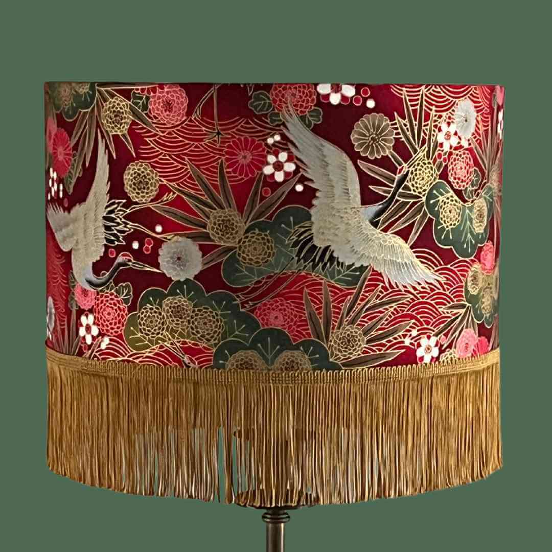 Drum Lampshade made with Authetic Japanese fabric with cranes, florals, metalic gold accents and gold fringe close up