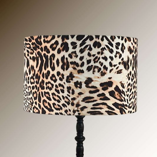 Lamp with a leopard print velvet shade on a black lamp base