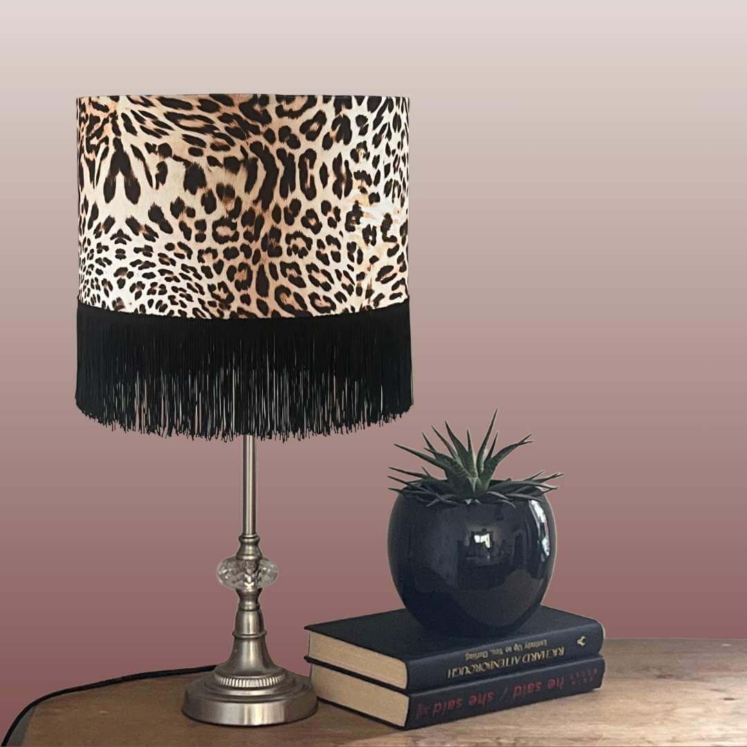 Leopard print velvet lampshade with fringe on table 