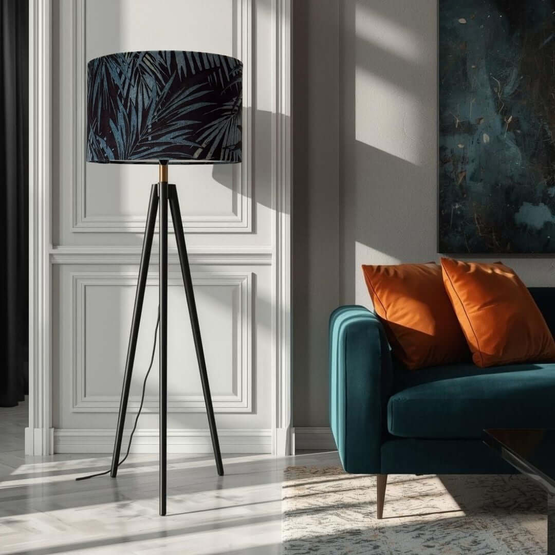Linwood Butterfly Palm velvet in Lago Drum Lampshade shown on a tripod lamp in a living room setting