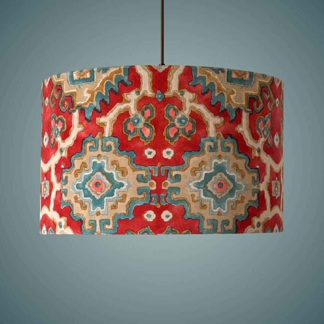 Linwood omega velvet kami drum lampshade in chilli shown on a ceiling light