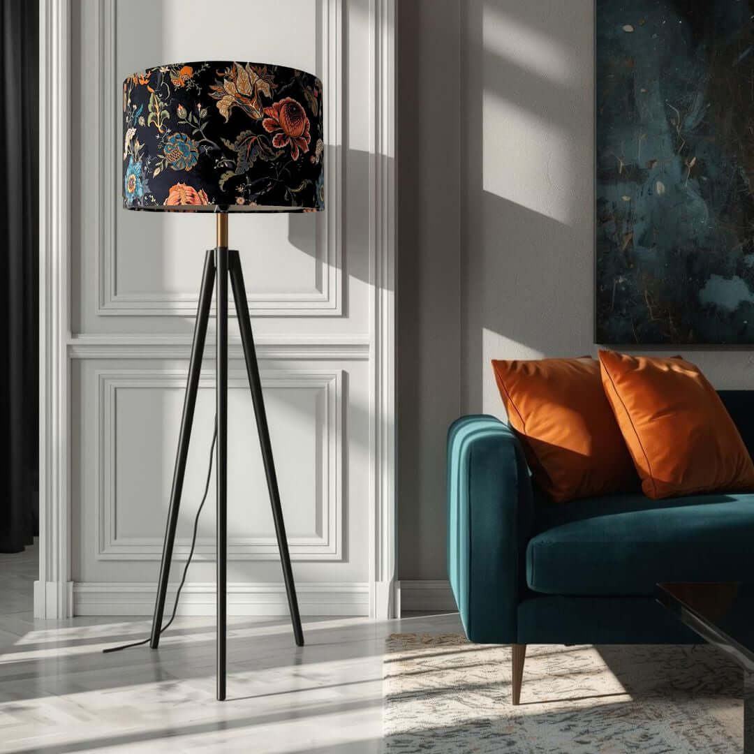 Drum lampshade made from Mallion & Knowles Athena midnight velvet on a tripod lamp base in living room setting