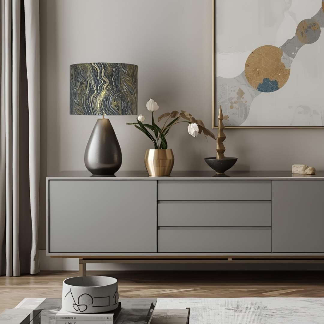 Modern interior with a grey sideboard, decorative lamp, and artwork on a wall.