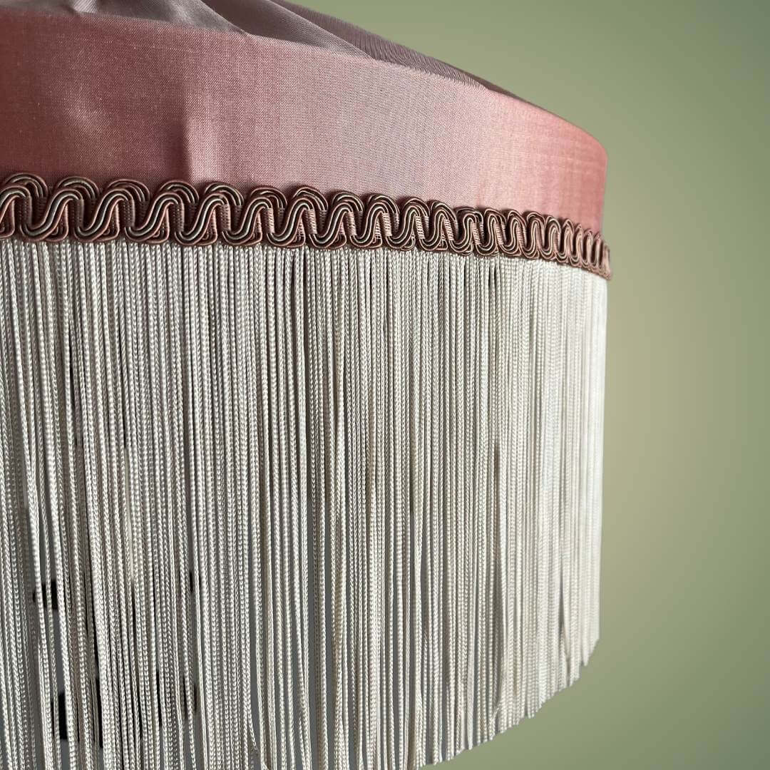 Pink silk tiffany style lampshade with ivory fringe showing details