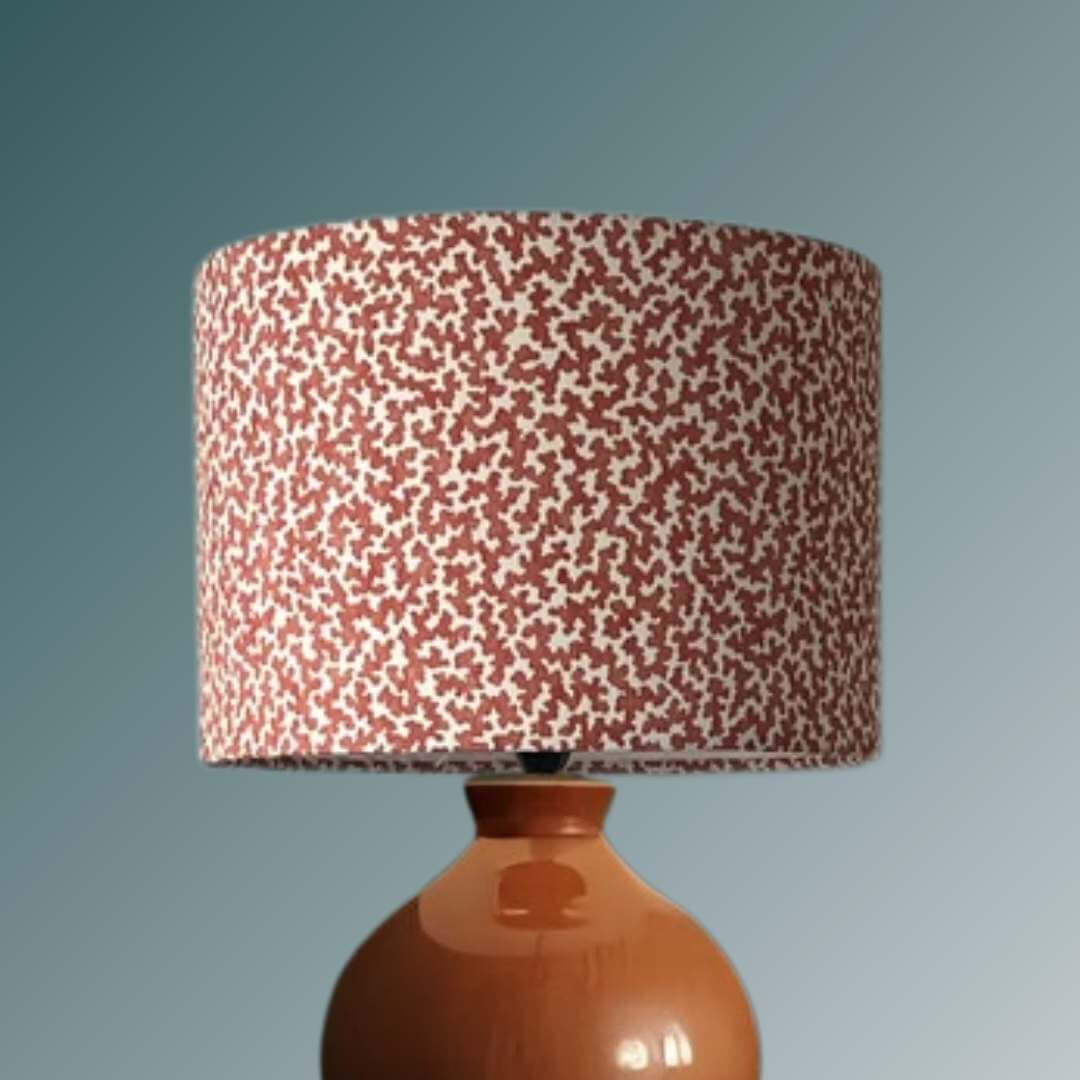Romo Junie Pimento drum lampshade shown on a teracotta lampbase 